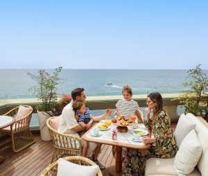 Official Amù Monte Carlo rooftop family dining photograph at Fairmont Monte Carlo; illustrative venue image, not a photograph of the Christmas brunch on 25 December 2026.